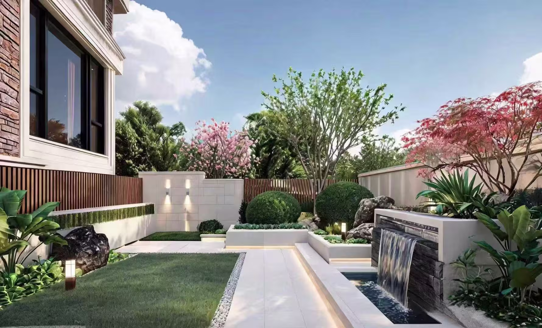 Light stone paving leading through a landscaped courtyard beside a water feature